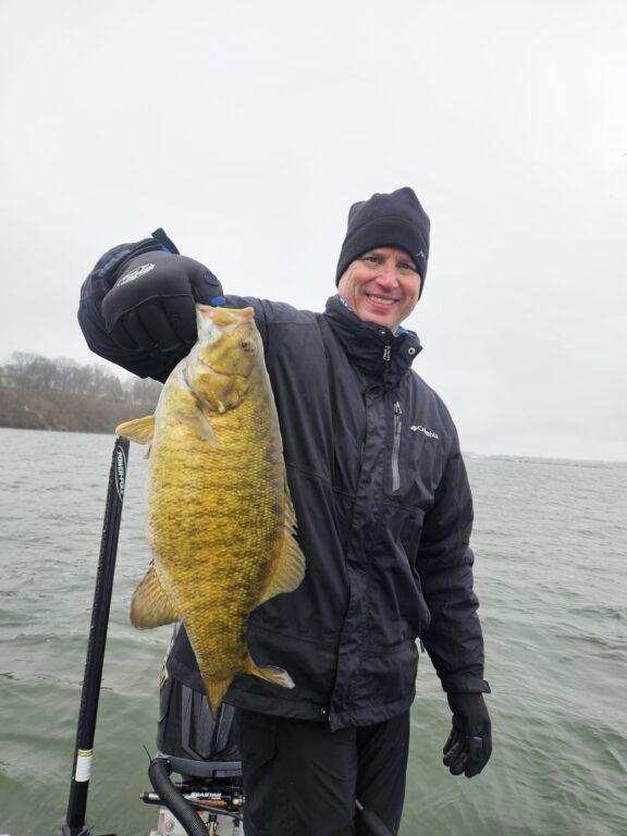 Client with spring smallmouth bass in Presque Isle Bay 2025 2