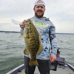 Brian with a 5 pound Presque Isle Bay smallmouth bass with Big Fat Bass Guide Service.