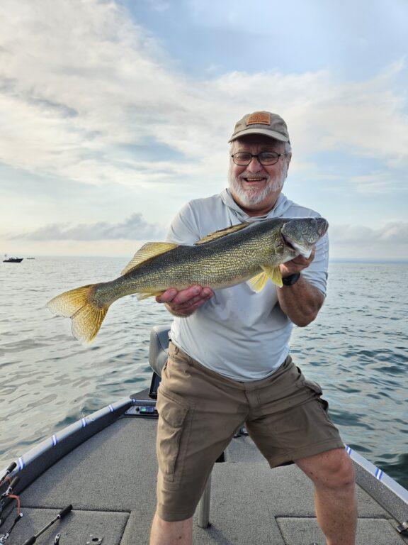 Client Gary with a Big Lake Erie walleye with Big Fat Bass Guide Service