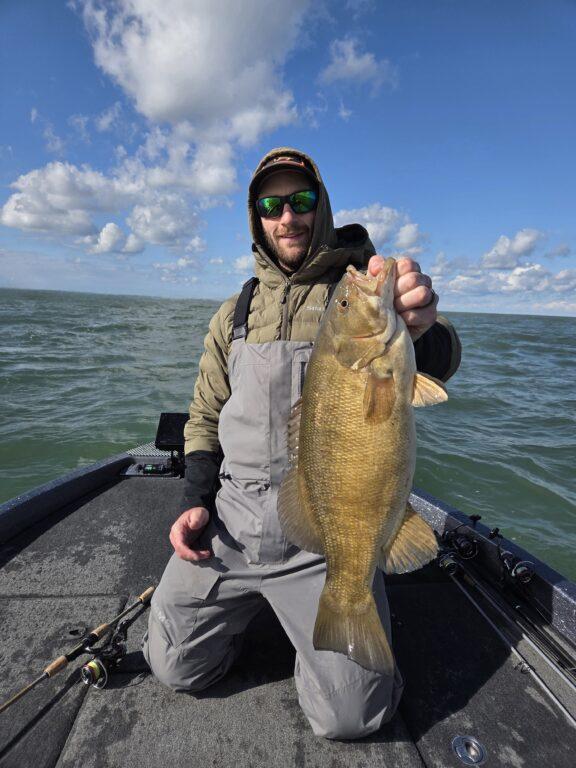 Alex with a big fat lake erie fall smallmouth bass
