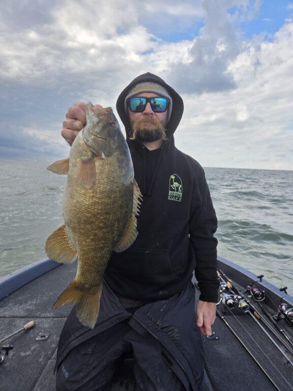 Big Fat Bass Guide Service client Jeff with a 6 lb plus smallmouth bass on Erie