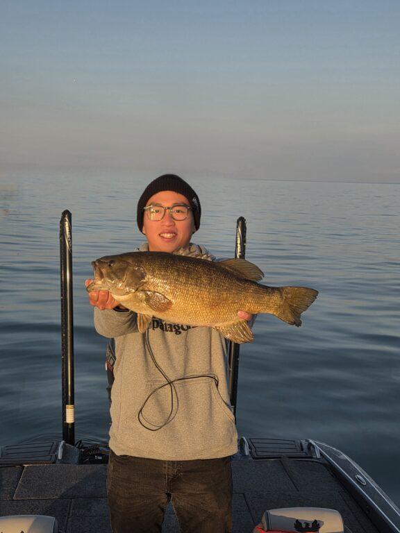 Big Fat Bass Guide Service client Junlin with a big fall Lake Erie smallmouth bass