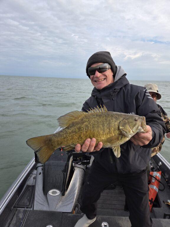 Big Fat Bass Guide Service client John with a big fall Lake Erie smallmouth bass