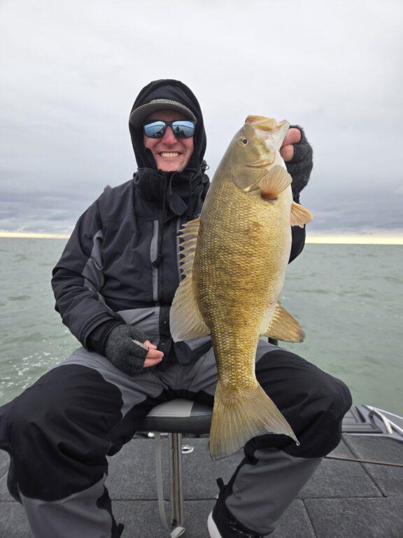 Big Fat Bass Guide Service client Kyle with a big fall Lake Erie smallmouth bass