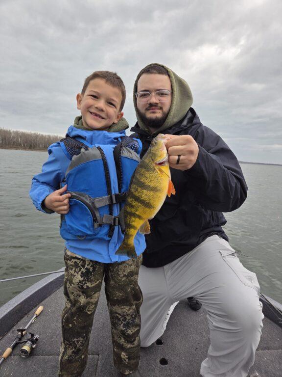 Logan and Cayden with big 2.05 lb 15 in Erie perch