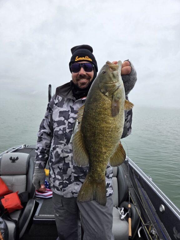 Josh with a big Lake Erie smallmouth bass in May 2026 with Big Fat Bass Guide Service