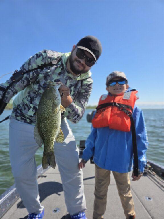 Father and son smallmouth fishing on Erie - Big Fat Bass Guide Service
