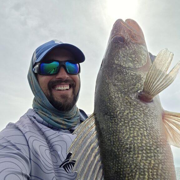 Lake Erie walleye fishing guide casting and jigging near Erie Pennsylvania