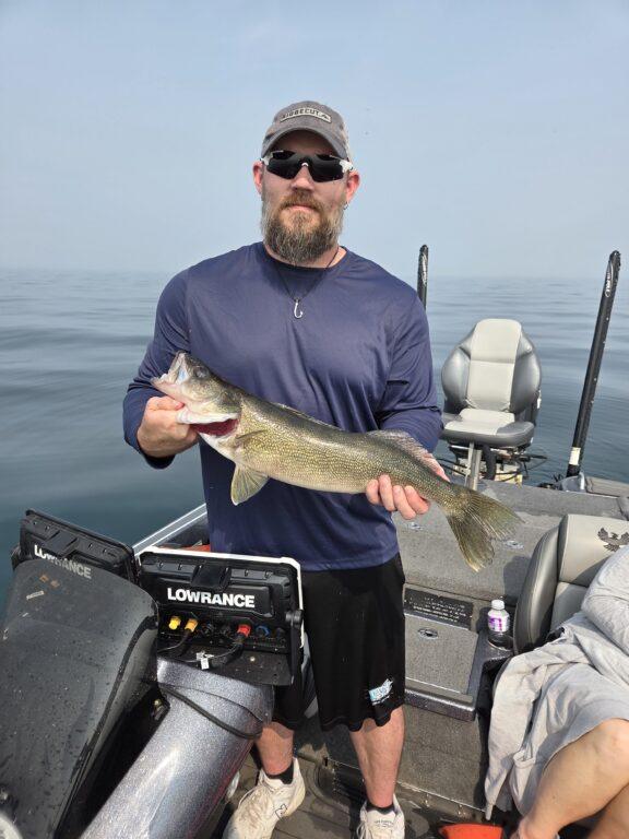 Casting for Lake Erie walleye during a summer guided fishing trip